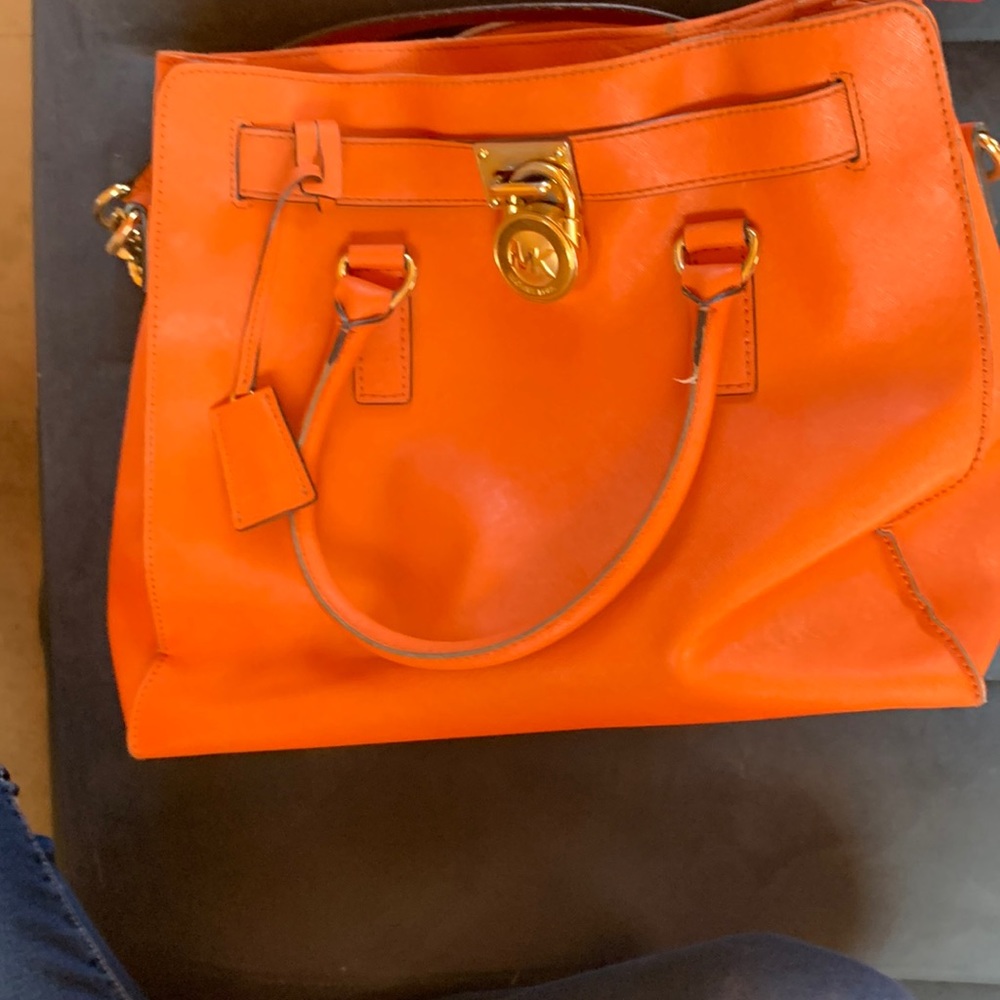 Orange Michaels Kors purse